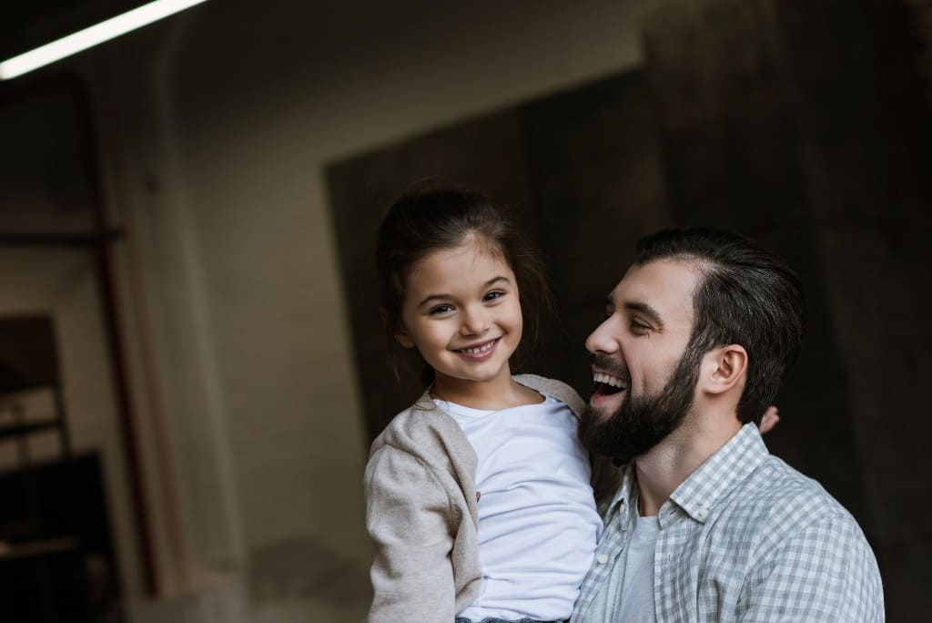 Daughter Smiling With Her Dad